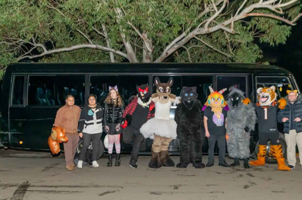 bus charter with a group of people dressed up in front